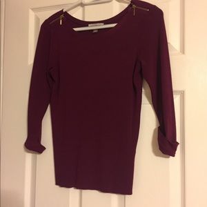 Maroon sweater with gold zippers