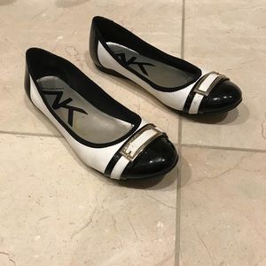 Well loved black and white flats