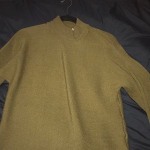 I am selling a dark green turtle neck sweater