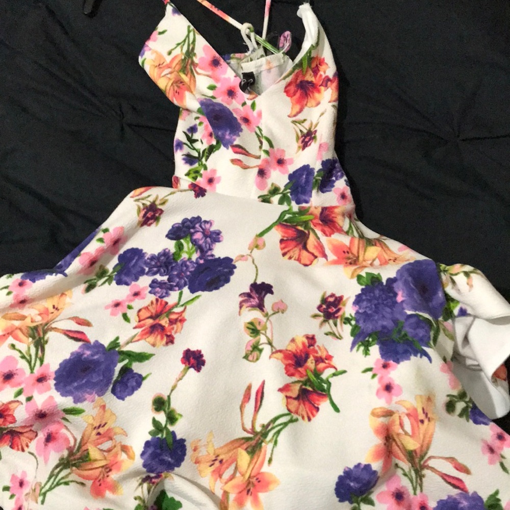 a  spaghetti strap dress with Colorful  flowers