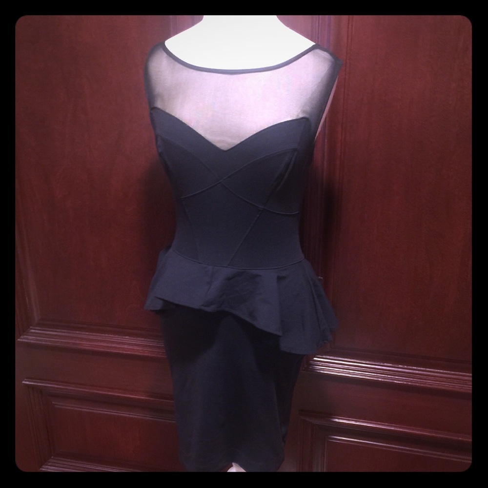 Bebe...Black form fitting dress...