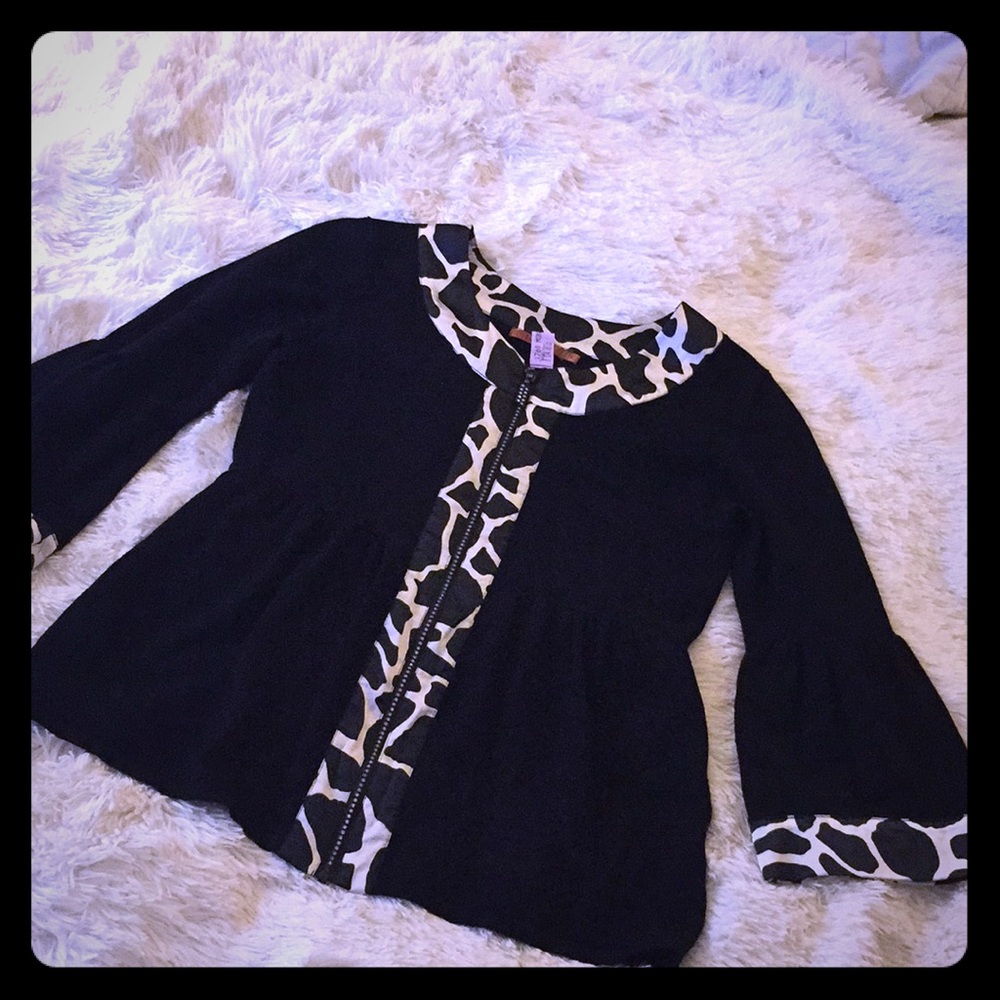 Billowy with bell sleeves, stretchy w animal print