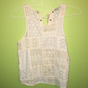 A cream, cross back, American eagle top
