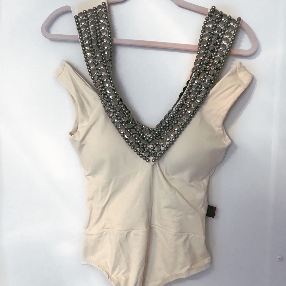 Black body (one piece) with embellishments.