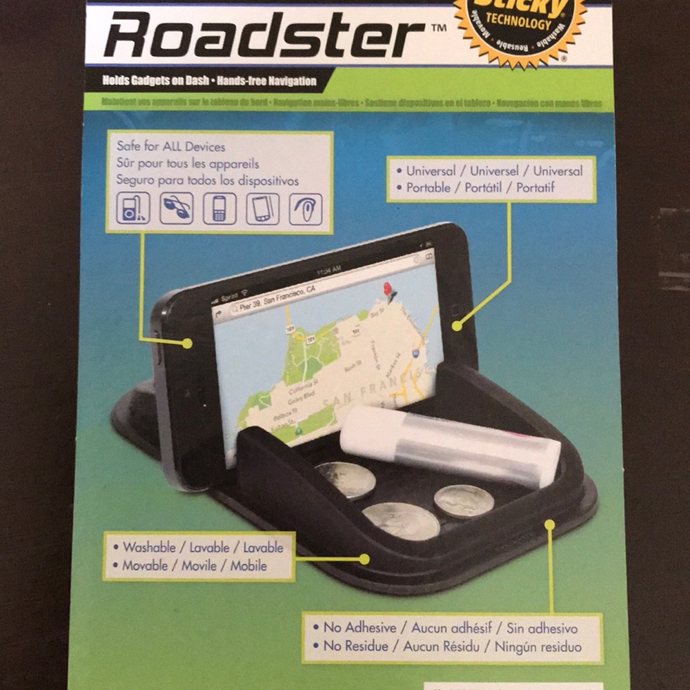Roadsters holds gadgets on dash.