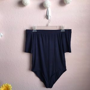 Baby blue off shoulder body suit.