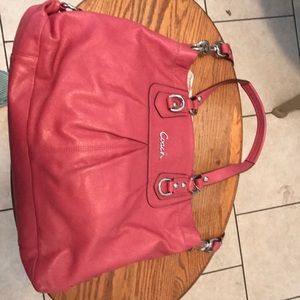 Dark pink Coach leather bag.