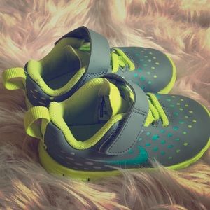 Neon green and gray kids Nike shoes