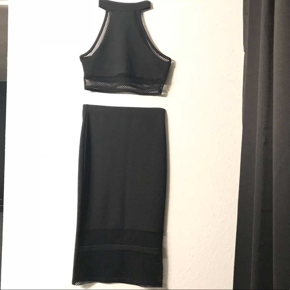 Two piece outfit crop top and high waisted skirt.