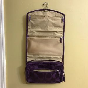 Like brand new Purple Coach travel organizer