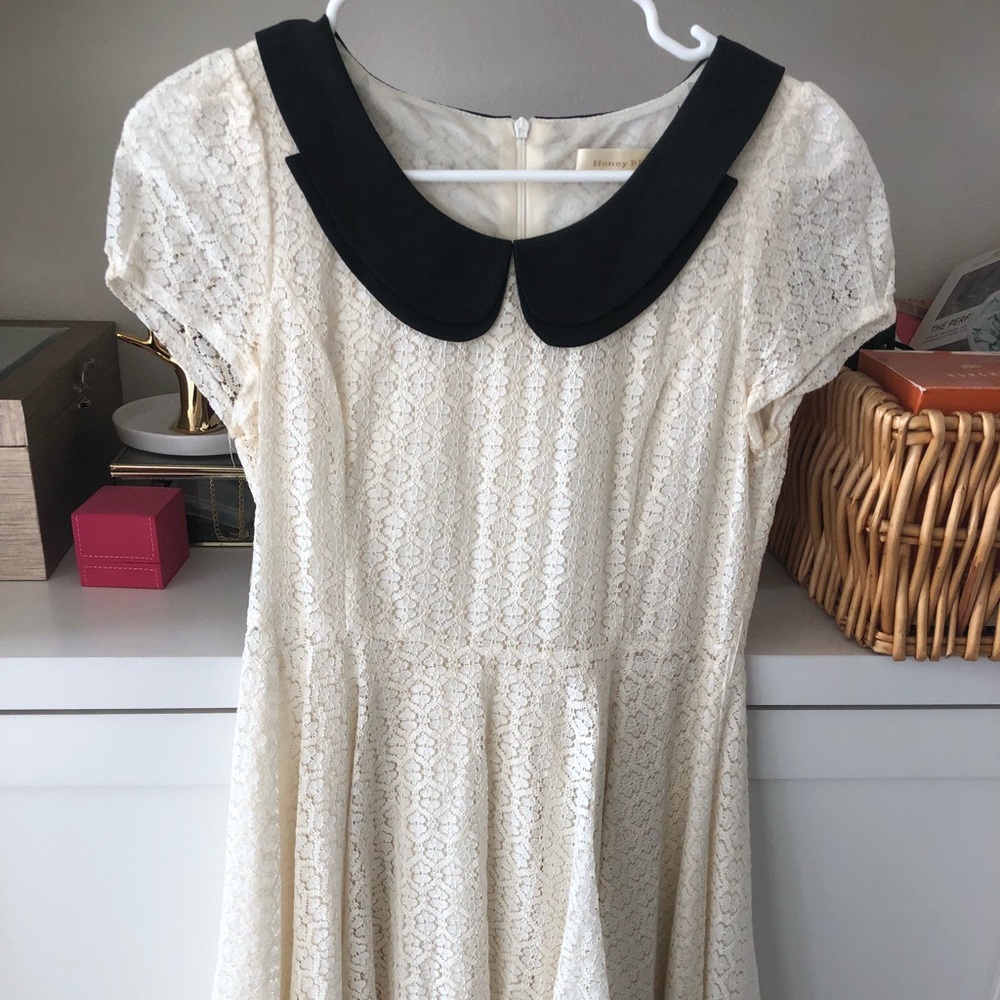 White dress with black collar and lace edge