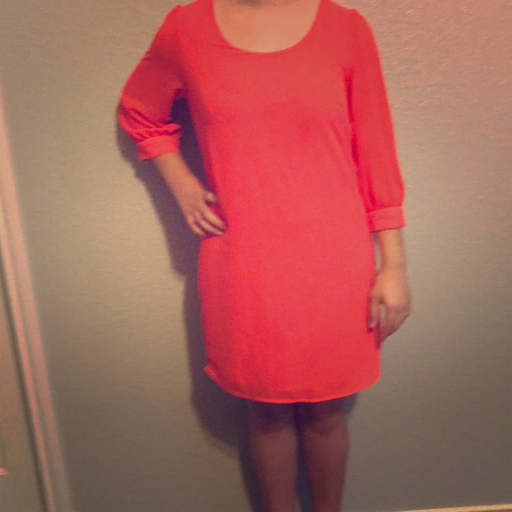 An orange peachy color dress