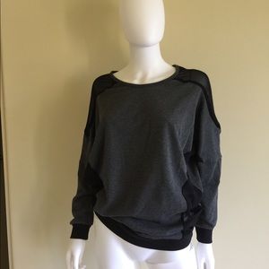 Sweater with sheer paneling