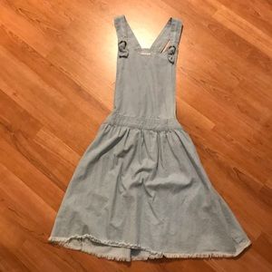 Blue overall dress.