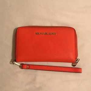 Micheal Kors’ Orange Wristlet