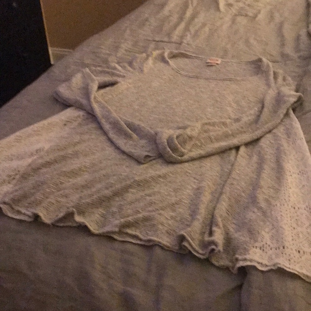 Gray sweater with white lace sides.