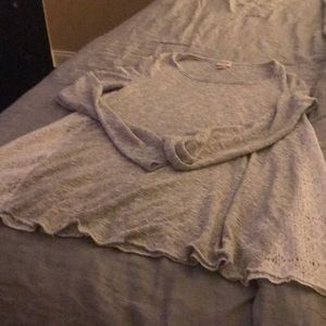 Gray sweater with white lace sides.