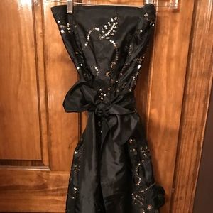 Black cocktail dress with gold sequin design