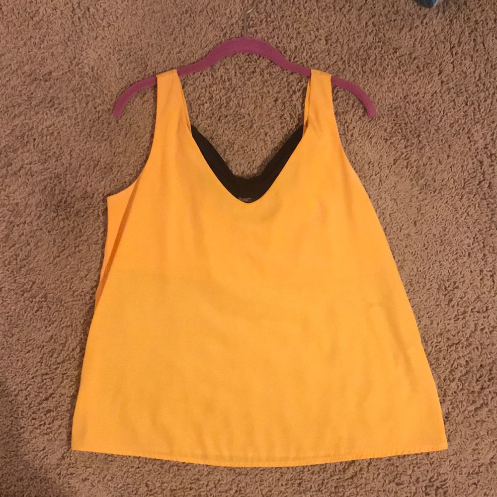 Yellow tank top with black bow accent on the back