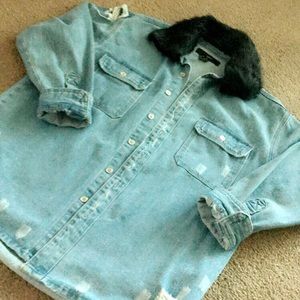 Damaged blue jean jacket