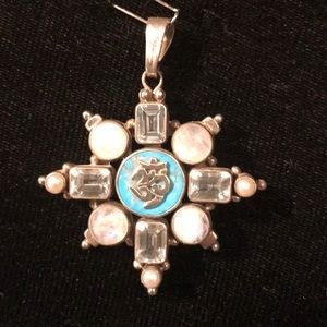 Om on Turquoise. Moonstone. Blue topaz. Pearls