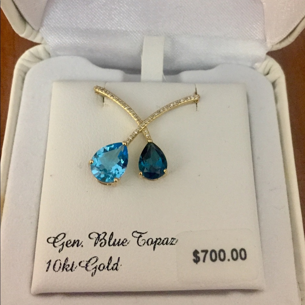 10K yellow gold with genuine blue topaz, brand new