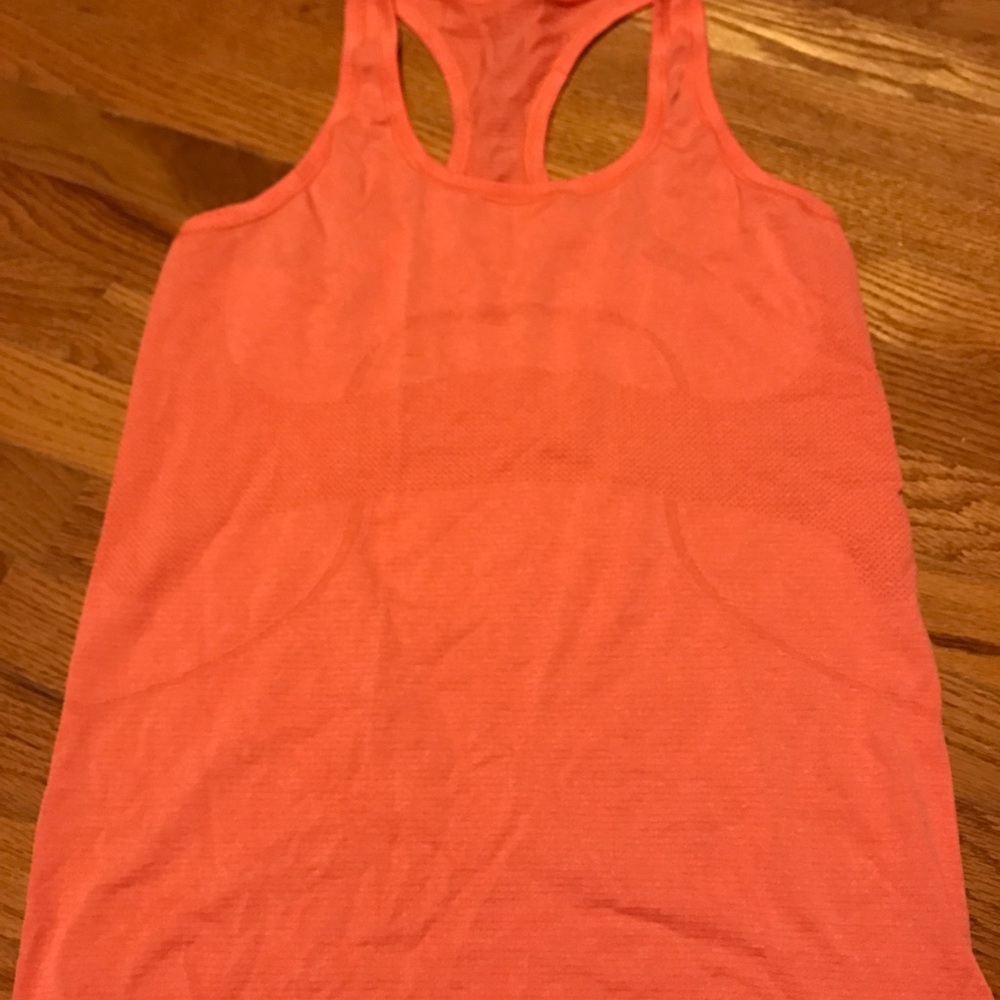 A orange Lulu sports top