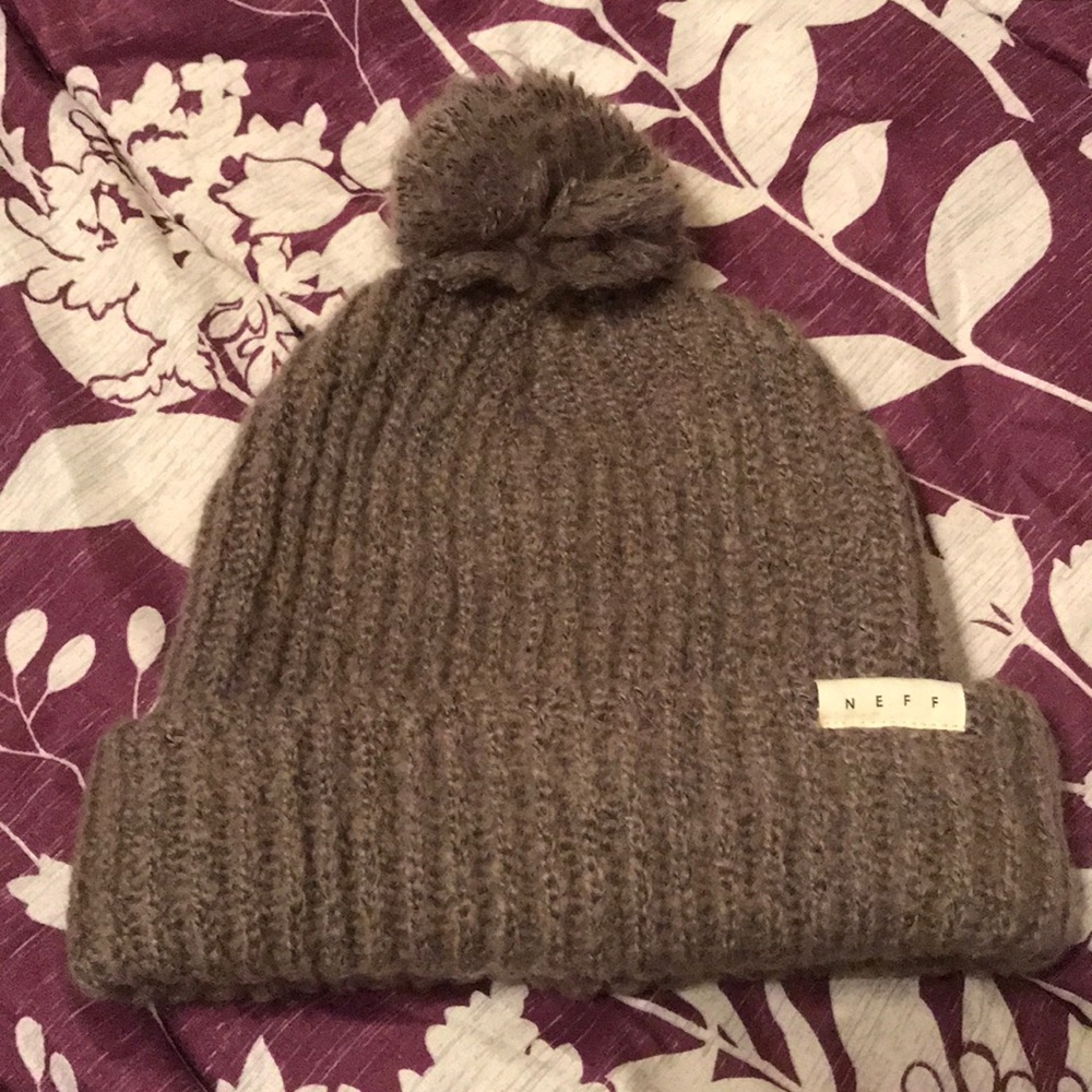 Grayish-brown Neff beanie with poof
