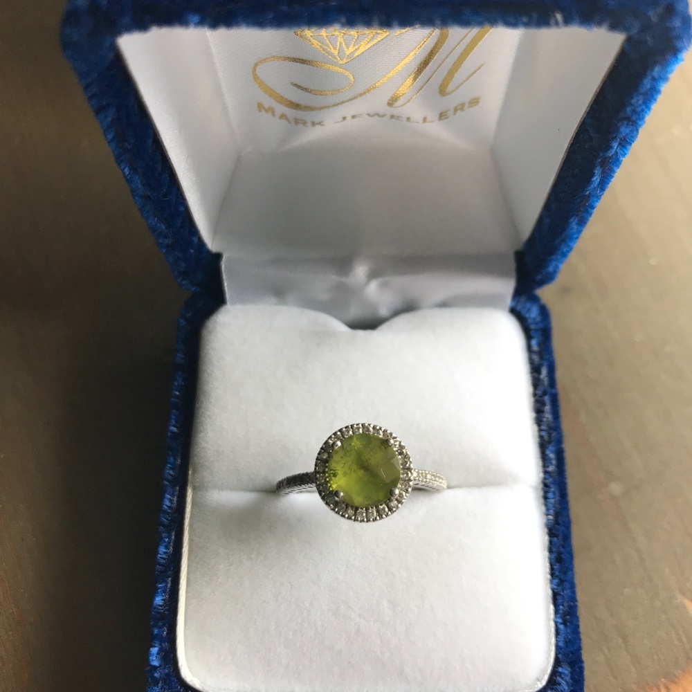 Peridot with diamond halo ring
