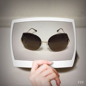 Nicole Miller Rimless Oversized Sunglasses.