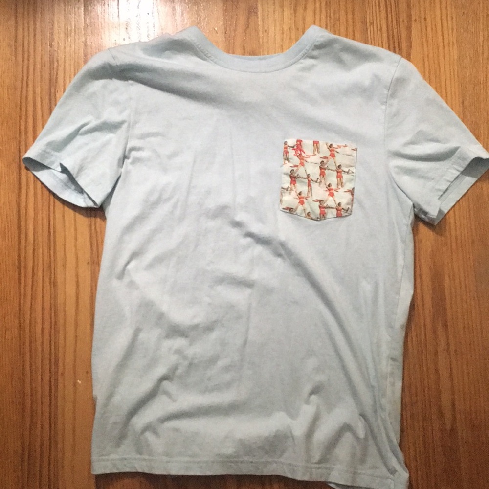 I’m selling a light blue tee, with a small pocket.