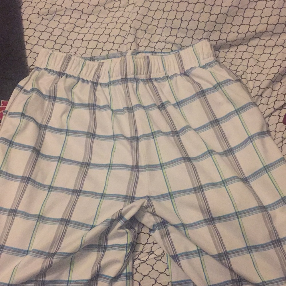 White, green, and gray Aeropostale swim trunks.
