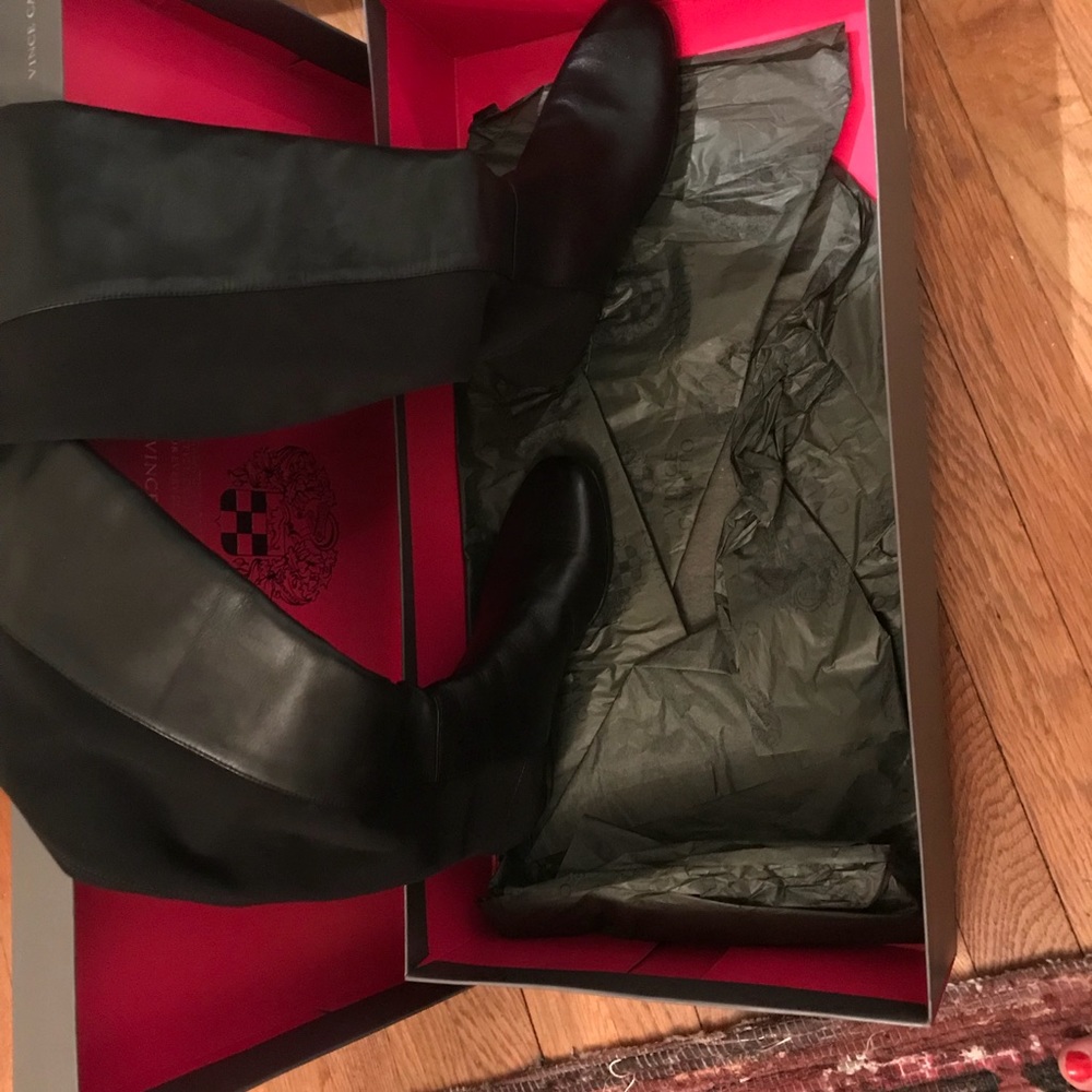 Tall knee high black boots.