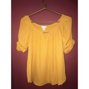 mustard colored blouse