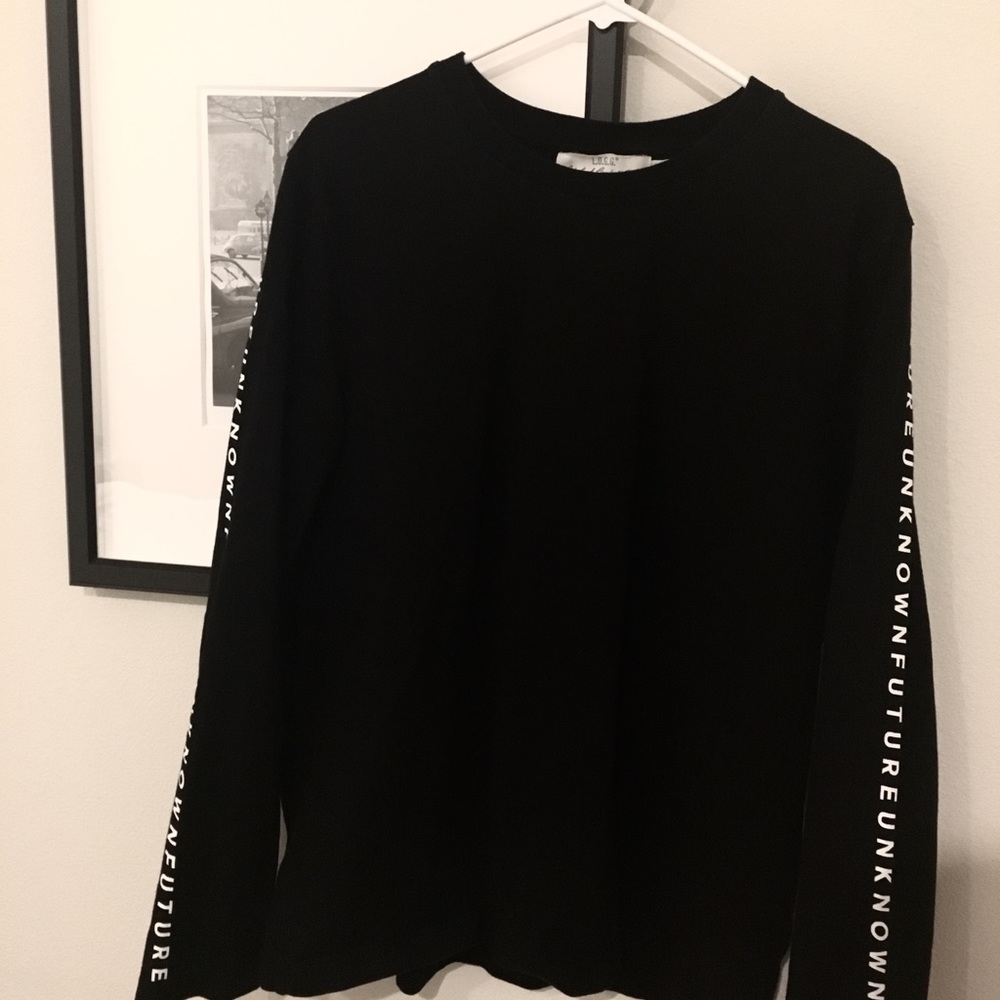 Black long sleeve shirt with writing