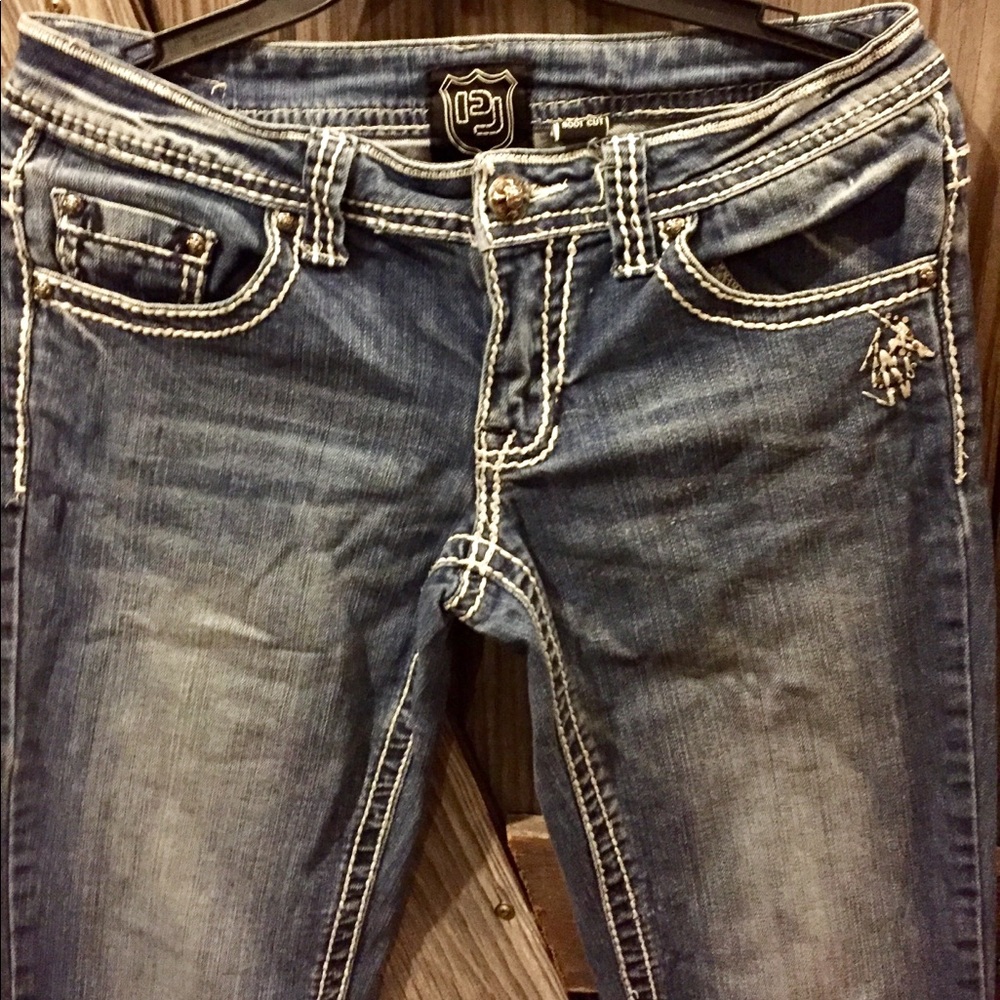Petrol Jeans Size 28, white stitching.