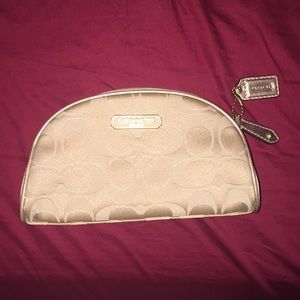 New gold coach cosmetic bag