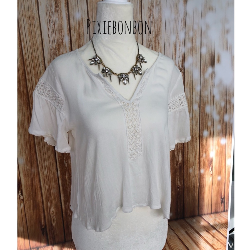 Elodie cream colored crochet trim blouse