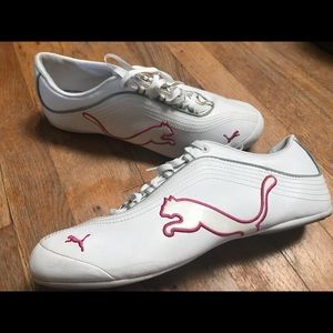 Women’s pink and white pumas. 9 1/2