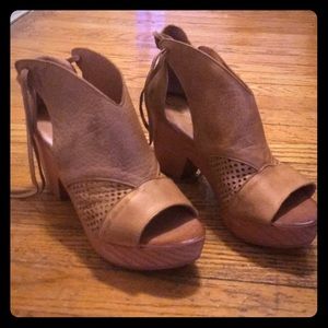 Free People tan clog-style leather wedges.
