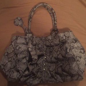 Bebe mid size purse. Gently used.