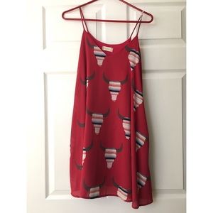 Super cute flowy pink dress with bullhead design