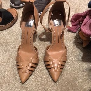 Soft brown leather heels missing one strap