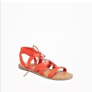 Lace up gladiator sandals.