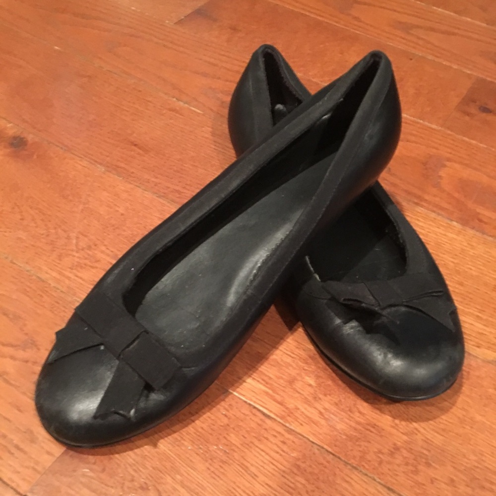 Black leather flats with bows