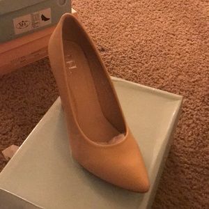 Tan pointed toe pumps
