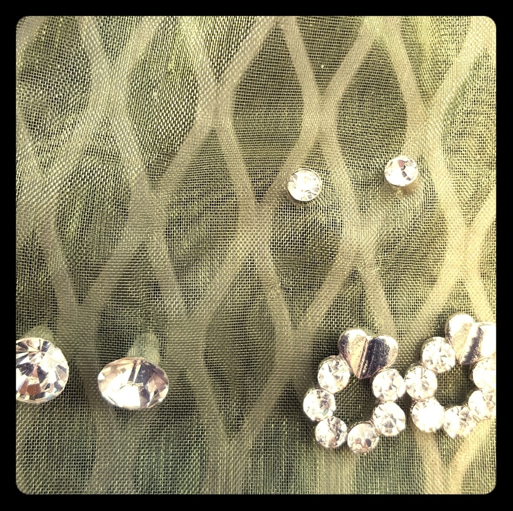 Trio of silvertoned rhinestone earrings.