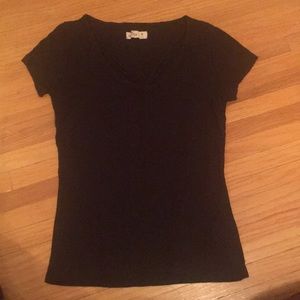 Black shirt with cross work at the top