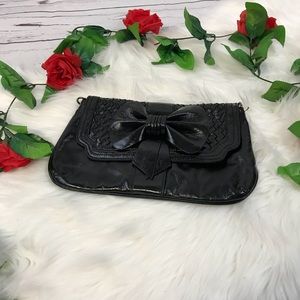 Black Aldo bow clutch
