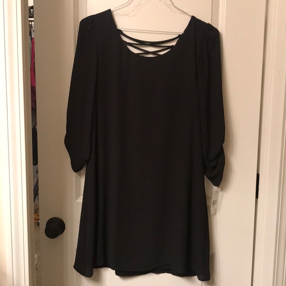 Black dress with 3-quarter length rolled sleeves